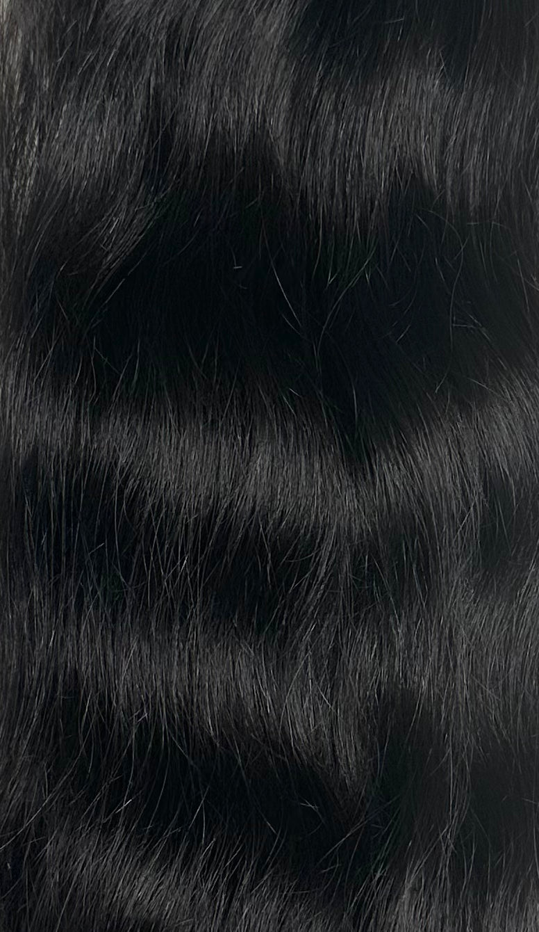 Close-up of black hair with a blurred background